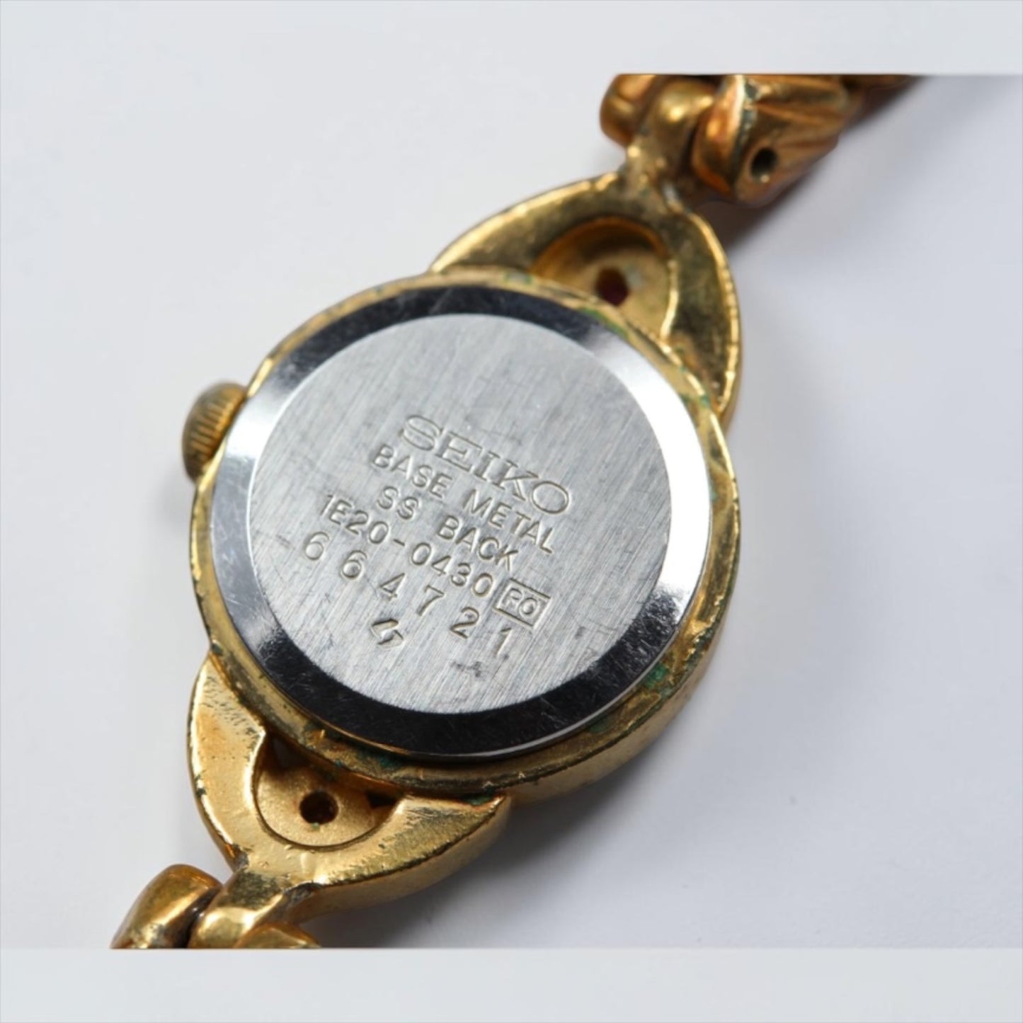 Seiko Ruby-Tone Stone Small-Case Gold Twist-Chain Watch