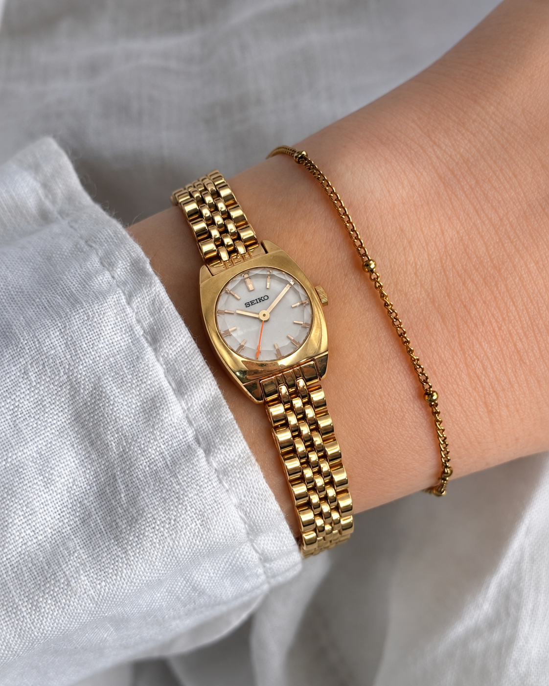 A distinctive vintage Seiko watch featuring a softly rounded gold-tone case