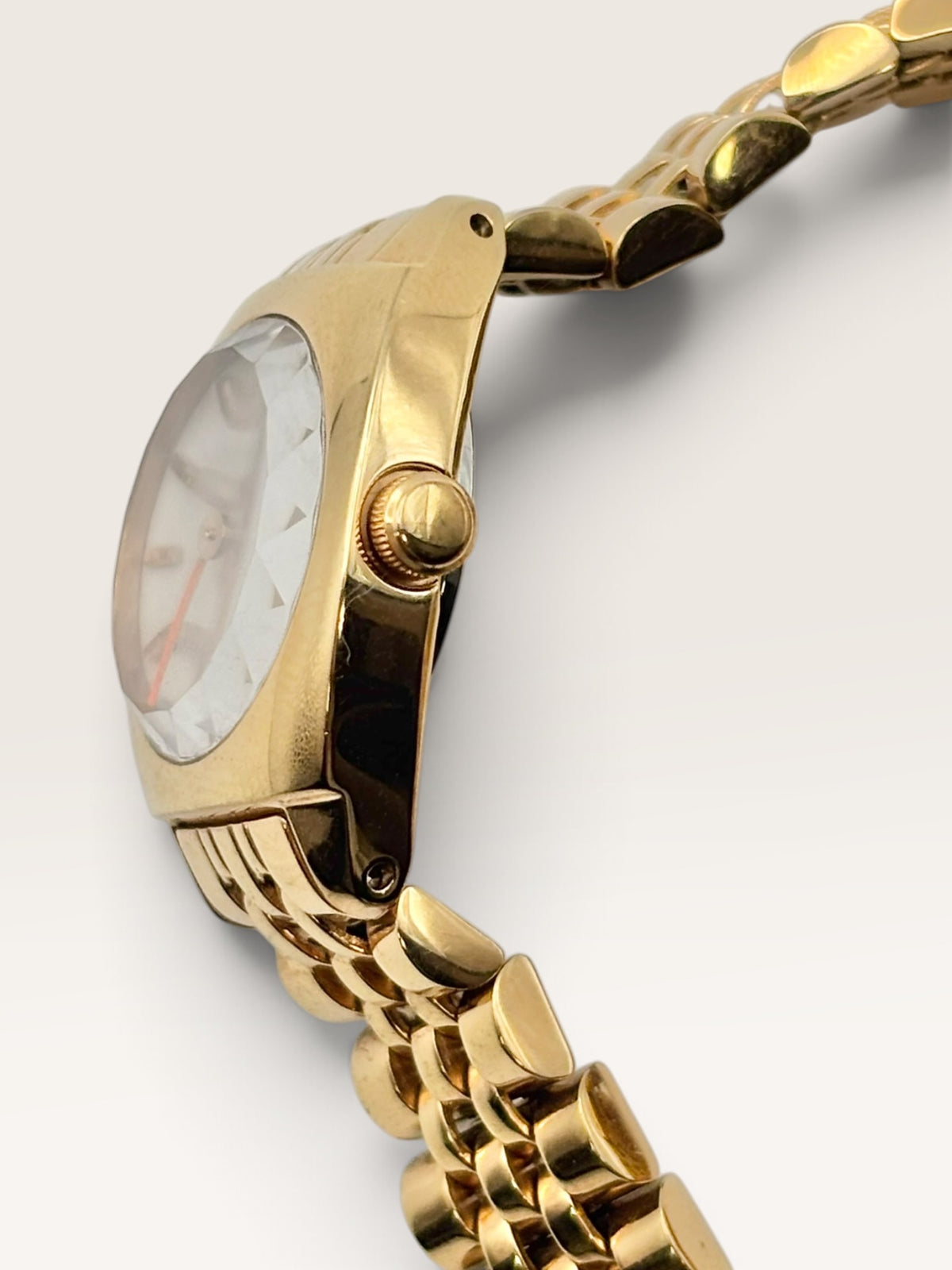 A distinctive vintage Seiko watch featuring a softly rounded gold-tone case